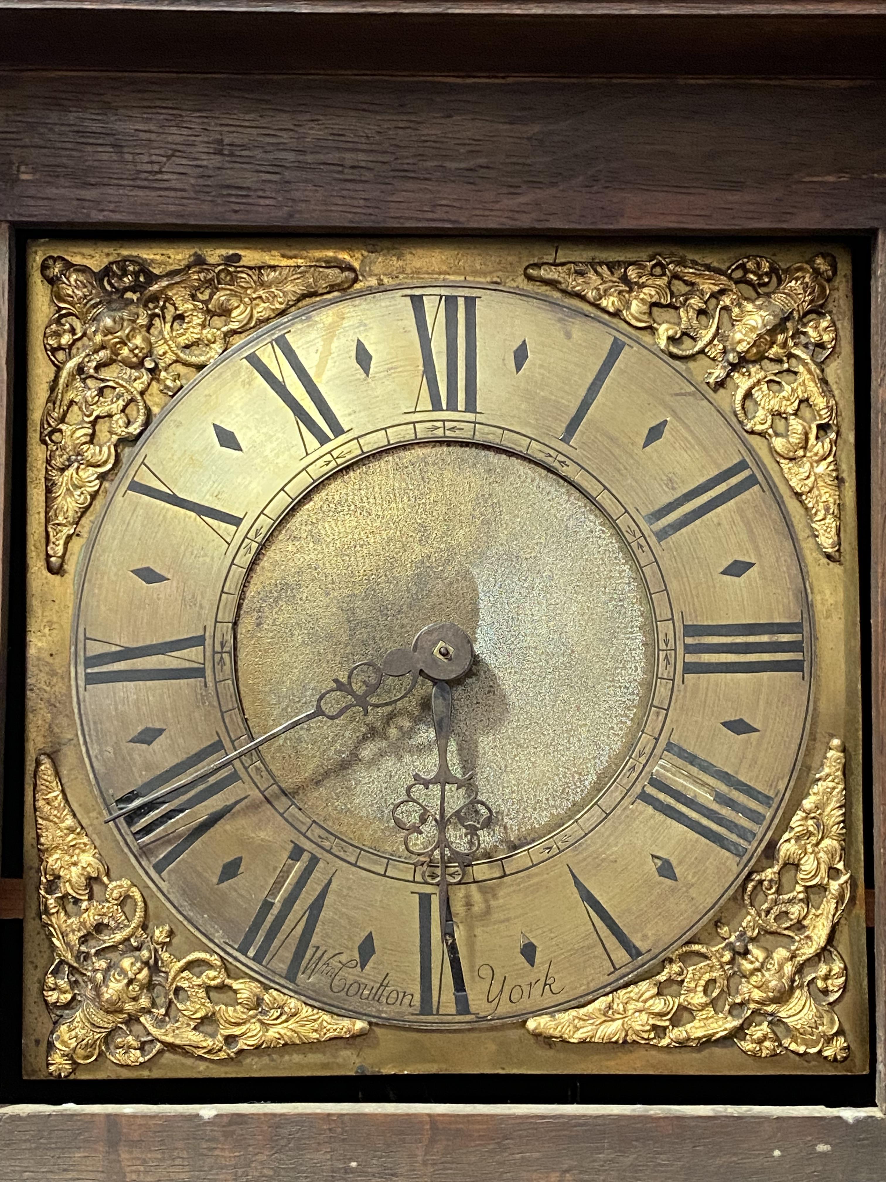 An English stained oak longcase clock, 18th century and later, the case profusely carved with - Image 2 of 3