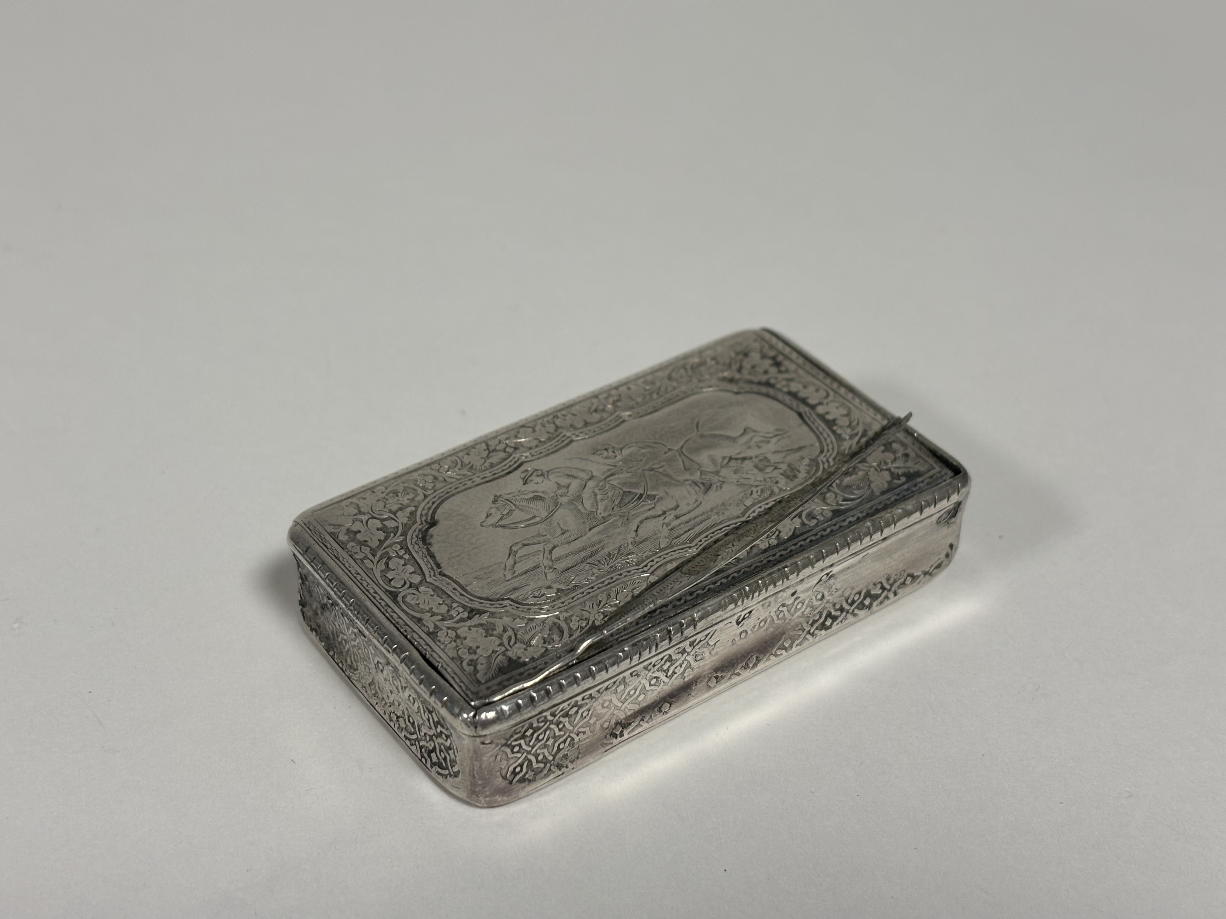 A French 19th century silver snuff box, of rectangular form, the cover engraved with a horse- - Image 4 of 4