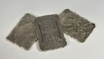 A group of three English silver card cases, 19th/early 20th century, each of shaped rectangular form