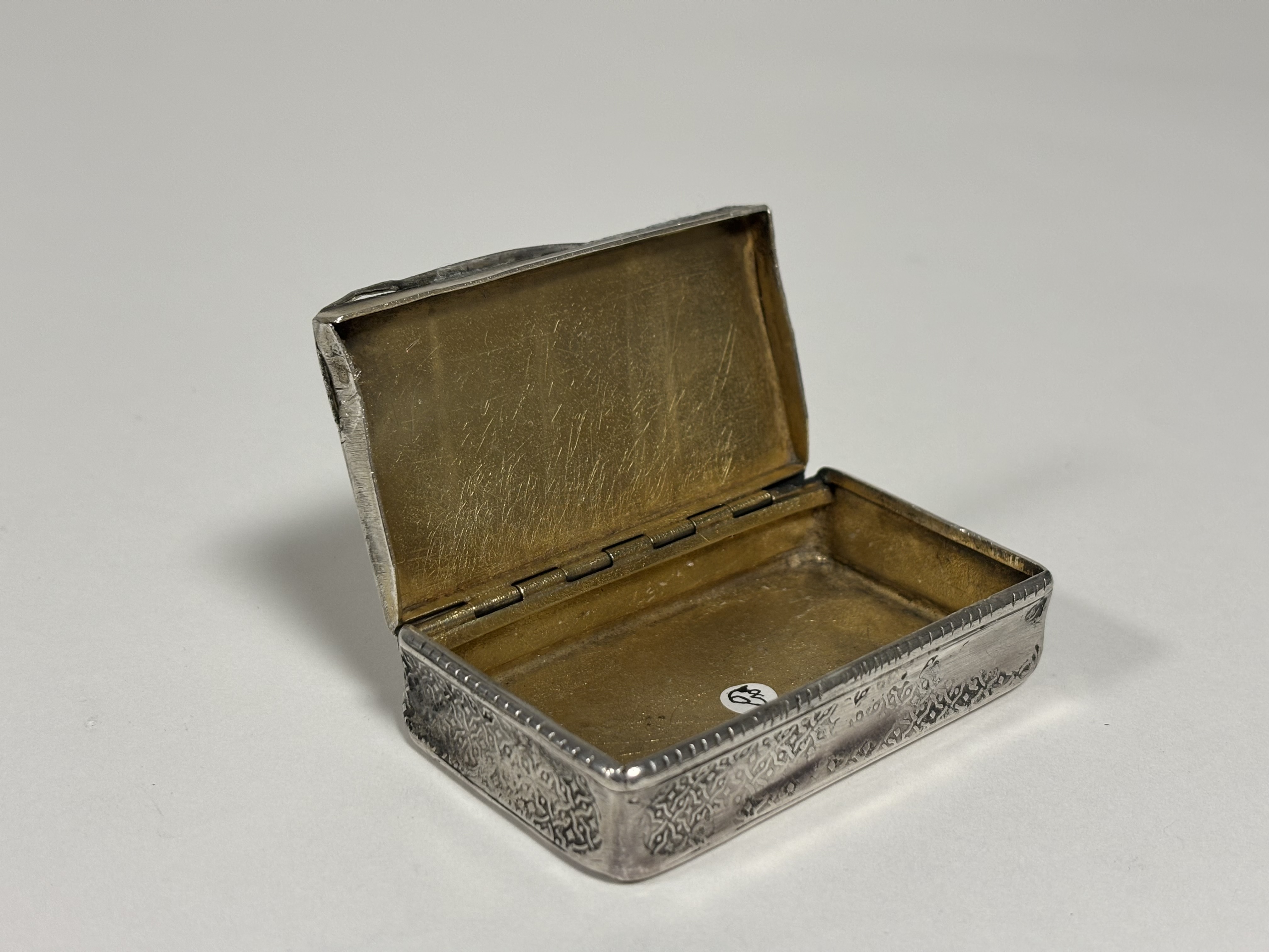 A French 19th century silver snuff box, of rectangular form, the cover engraved with a horse- - Image 3 of 4