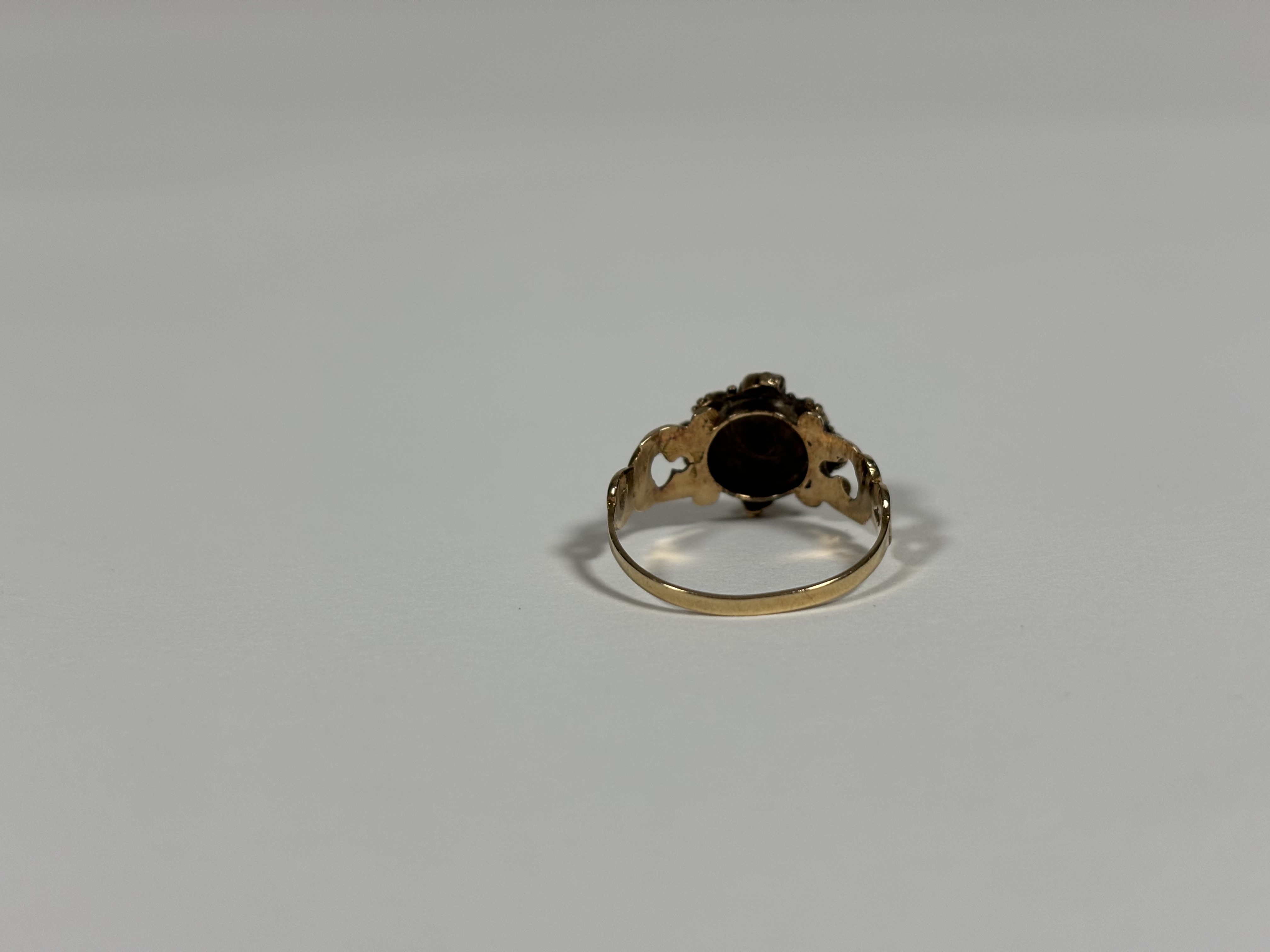 A mid-19th century emerald, ruby or garnet and seed pearl ring, set to the centre with a heart-cut - Image 3 of 3
