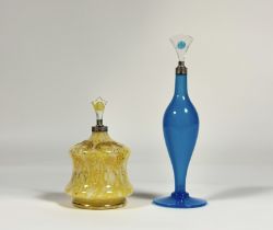 Two early 20th century silver-mounted scent bottles: the first of slender baluster form, in