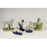 A group of five Staffordshire models, 19th century and later, comprising: a flatback prancing zebra;