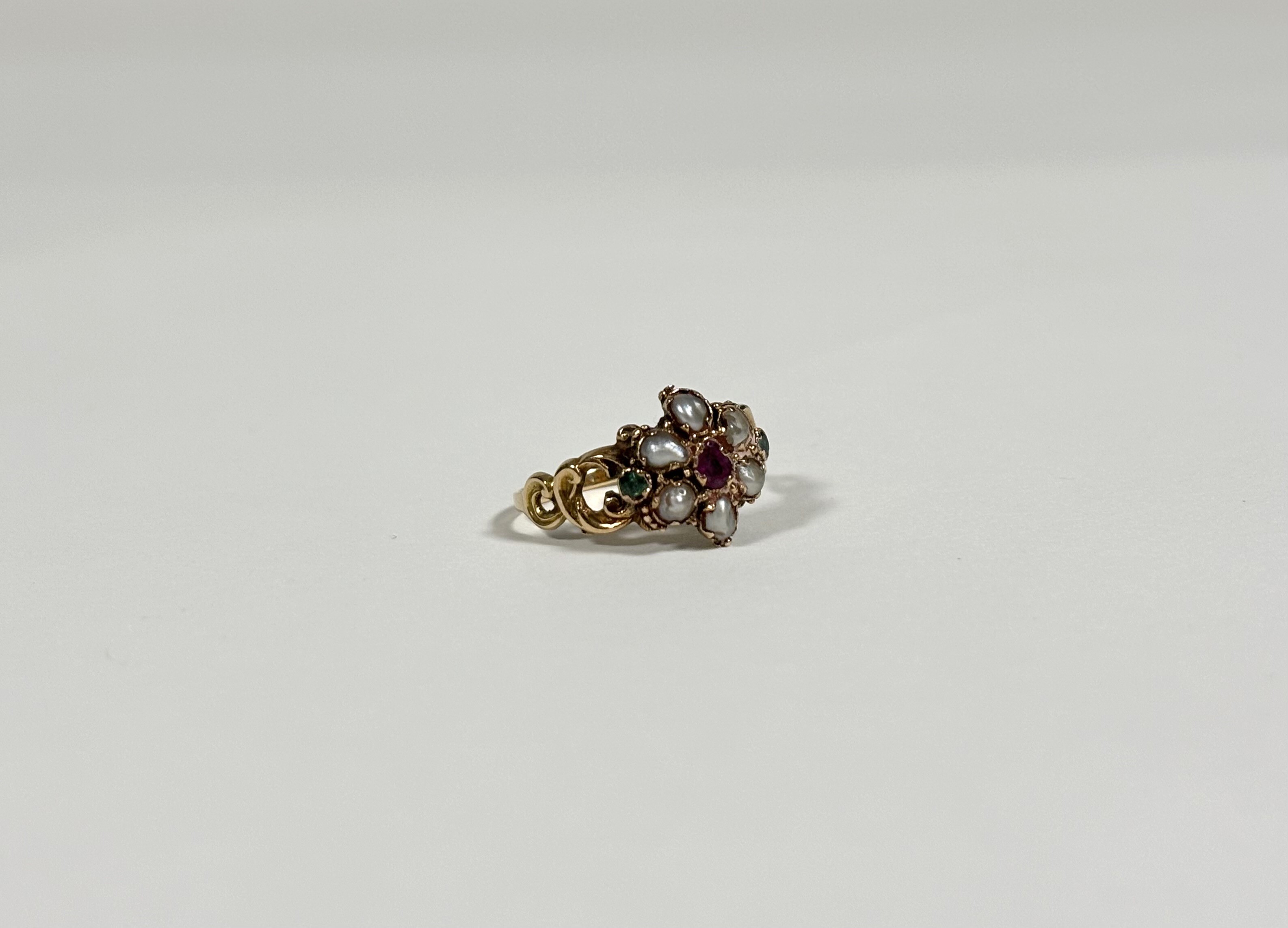 A mid-19th century emerald, ruby or garnet and seed pearl ring, set to the centre with a heart-cut - Image 2 of 3