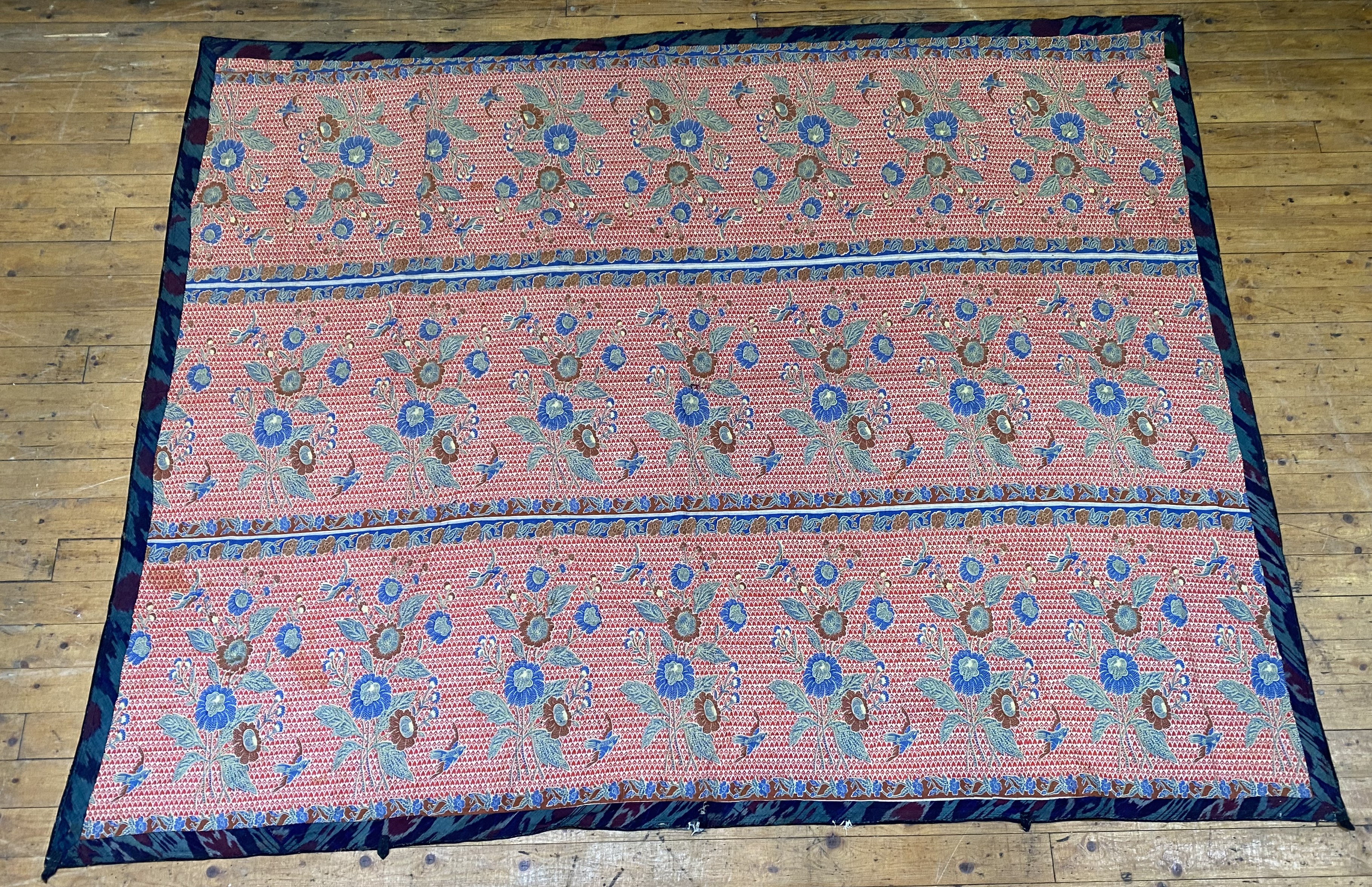 A large Turkoman Suzani wall hanging, circa 1900, the purple ground embroidered with interlaced - Image 2 of 4