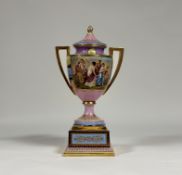 A late 19th century Vienna porcelain covered urn on stand, of hipped baluster form, painted with a