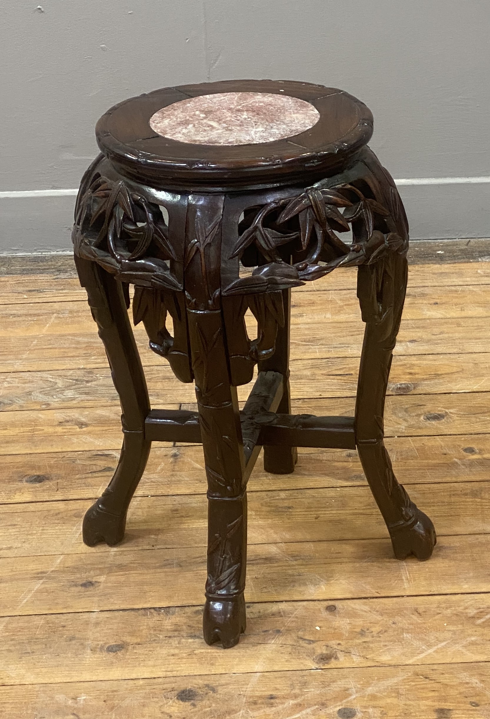 A late Qing dynasty Chinese stained hardwood jardinière stand, the circular top inset with rouge - Image 2 of 2