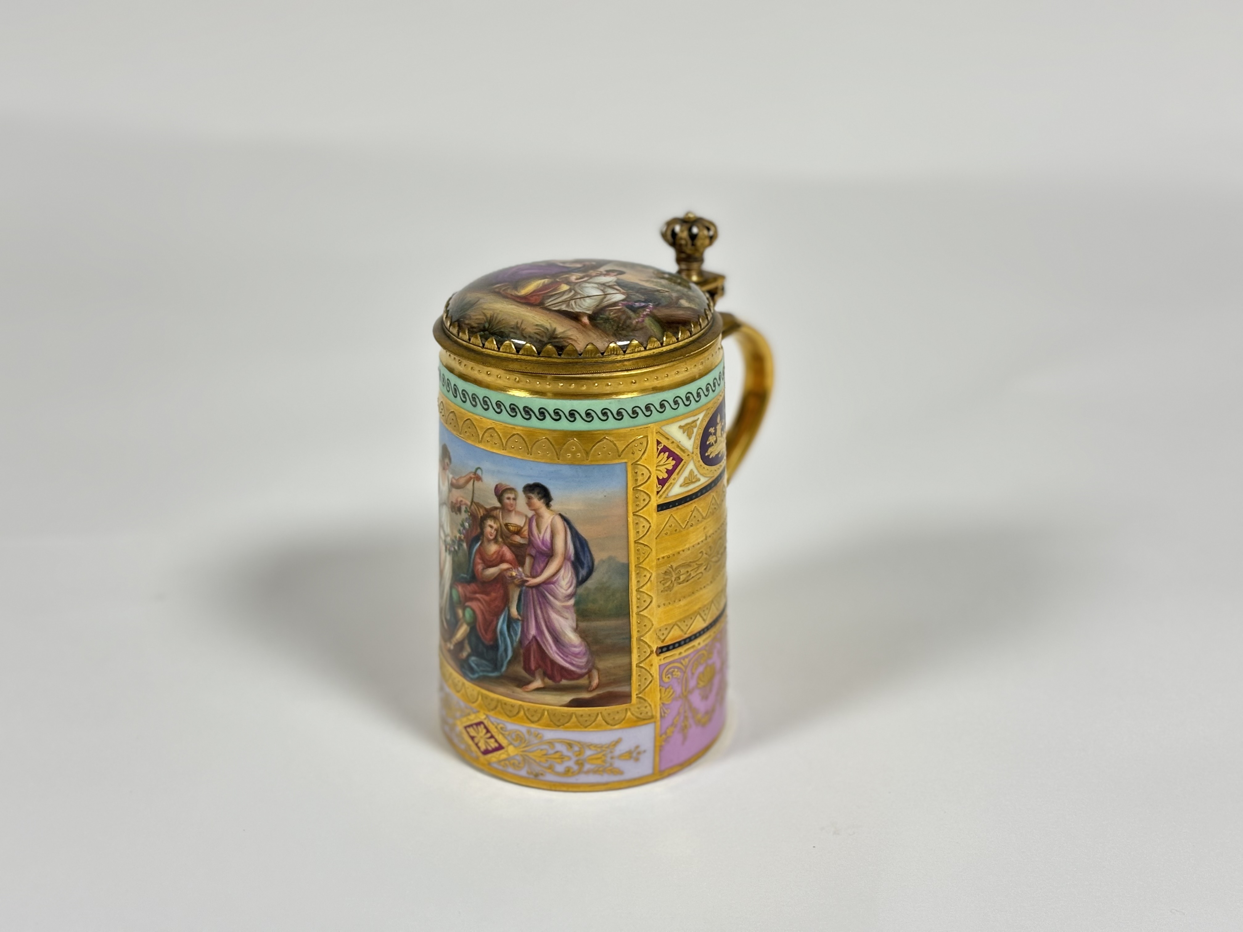 A late 19th century gilt-metal mounted Vienna porcelain tankard and cover, of cylindrical form, with