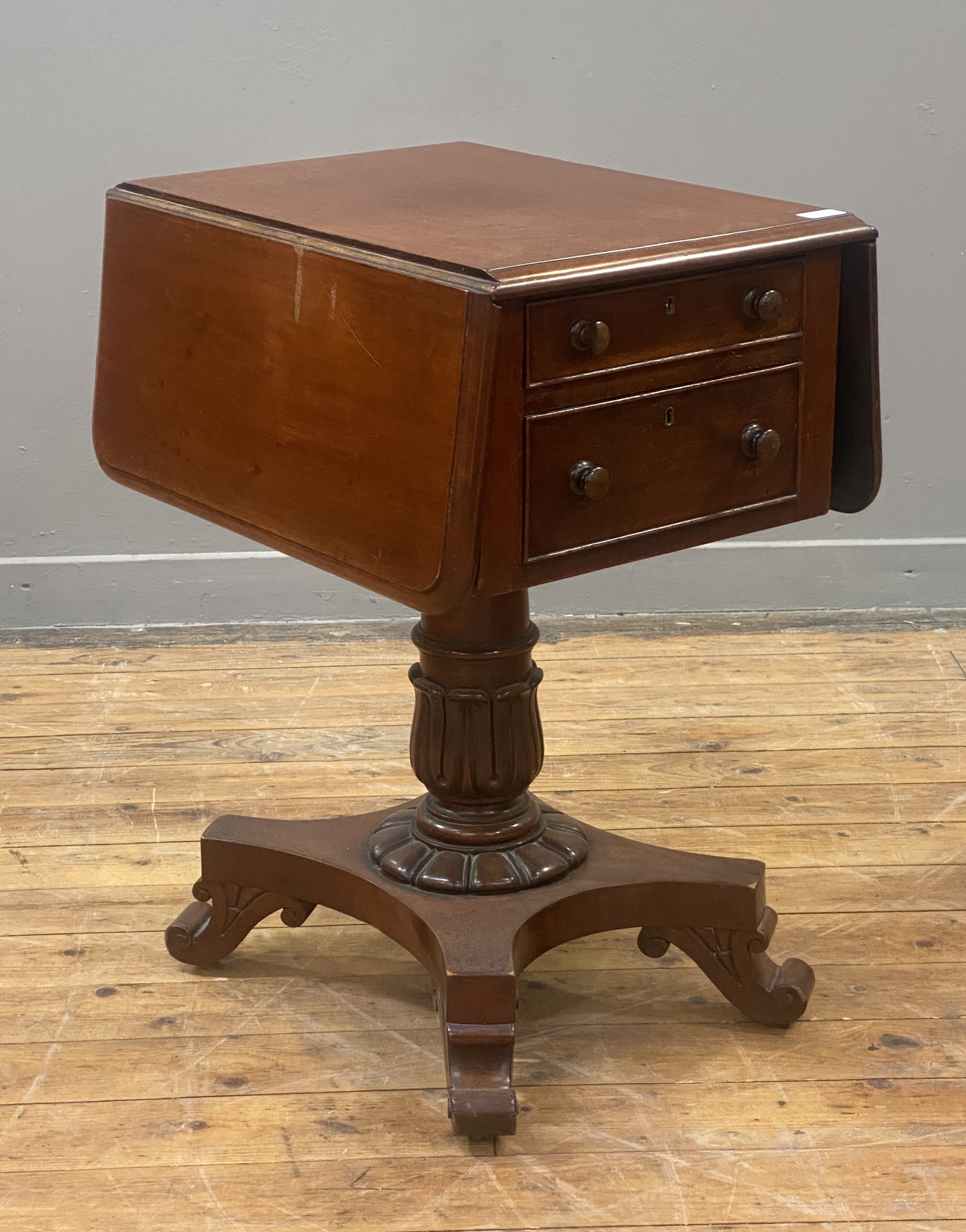 A William IV mahogany sewing table, the top with drop leaf to each side, above two drawers opposed