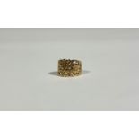 An early 19th century gold ring, the tapering band pierced and scroll and leaf-cast, further