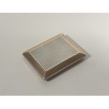 A George V silver and silver-gilt card case, F.C. Richards, Birmingham 1927, of rectangular form,