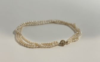 A four-strand freshwater pearl necklace, on a pierced gold-plated clasp. Length 41cm