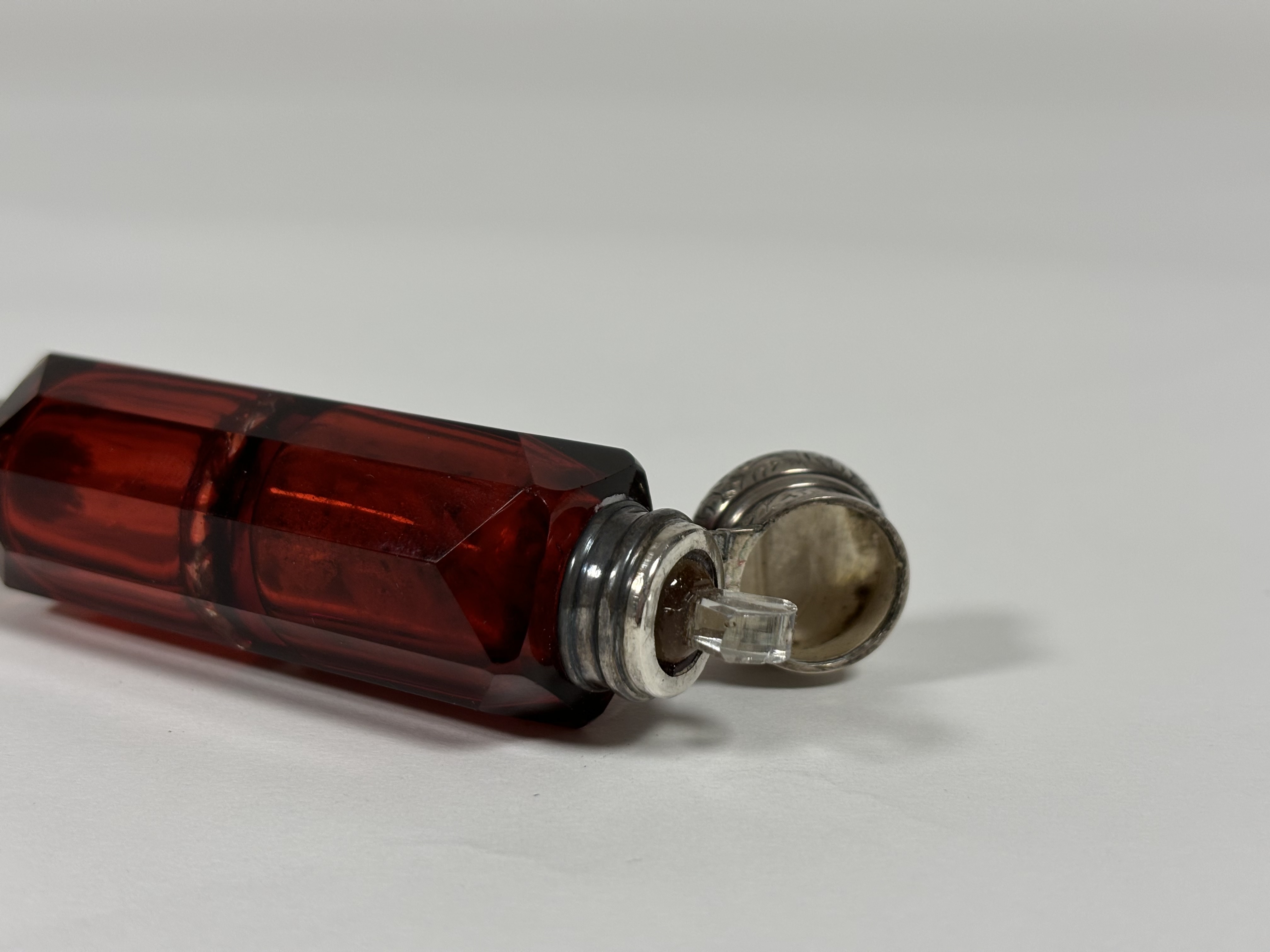 Two late 19th century ruby glass scent bottles: the first double-ended in faceted glass with - Image 9 of 10