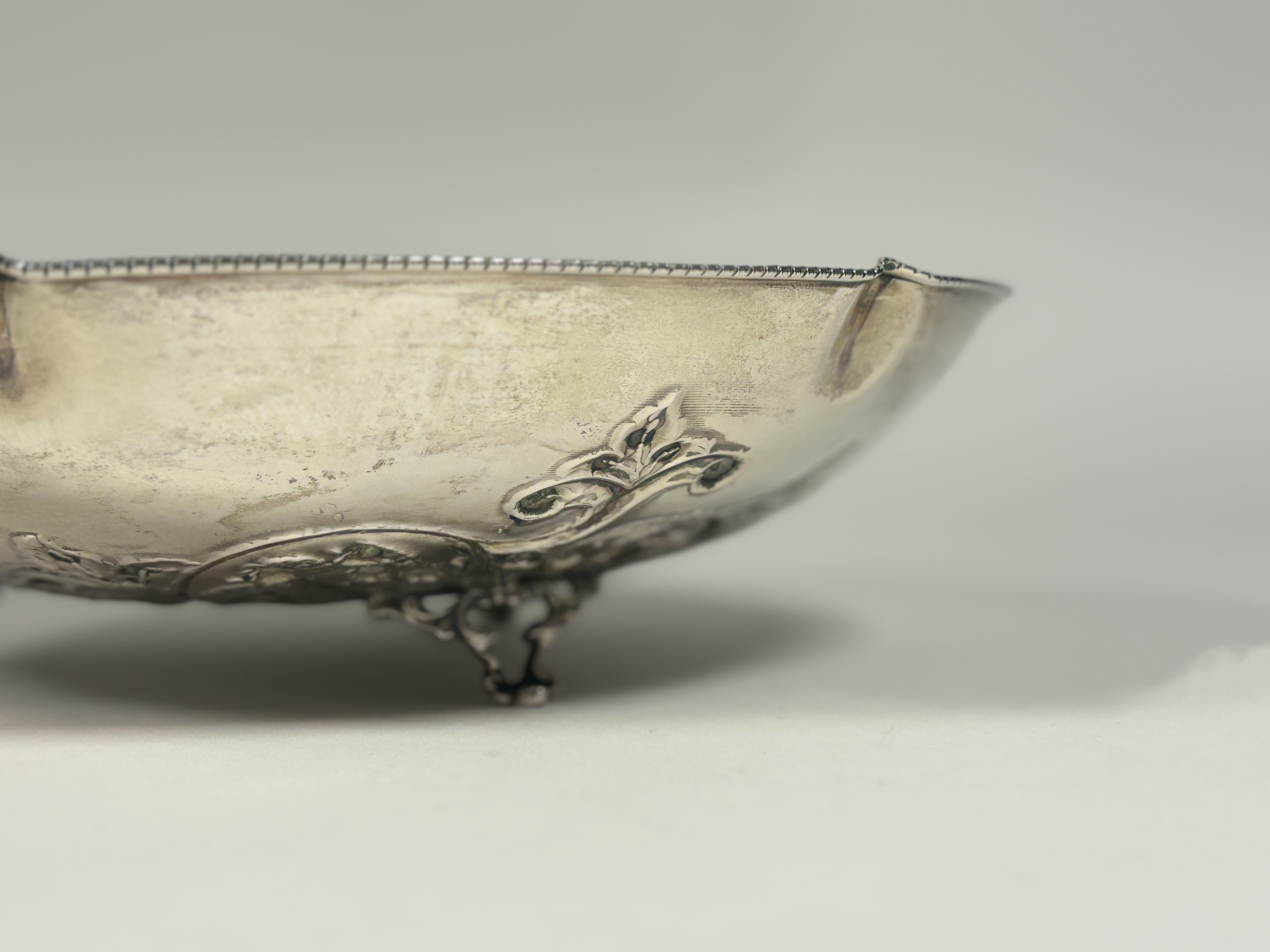 A Continental silver centre bowl, circular, the well repousse with scrolling foliage, raised on - Image 3 of 4