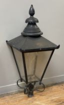 A Victorian style street lantern of characteristic tapered form, black painted copper, with circular