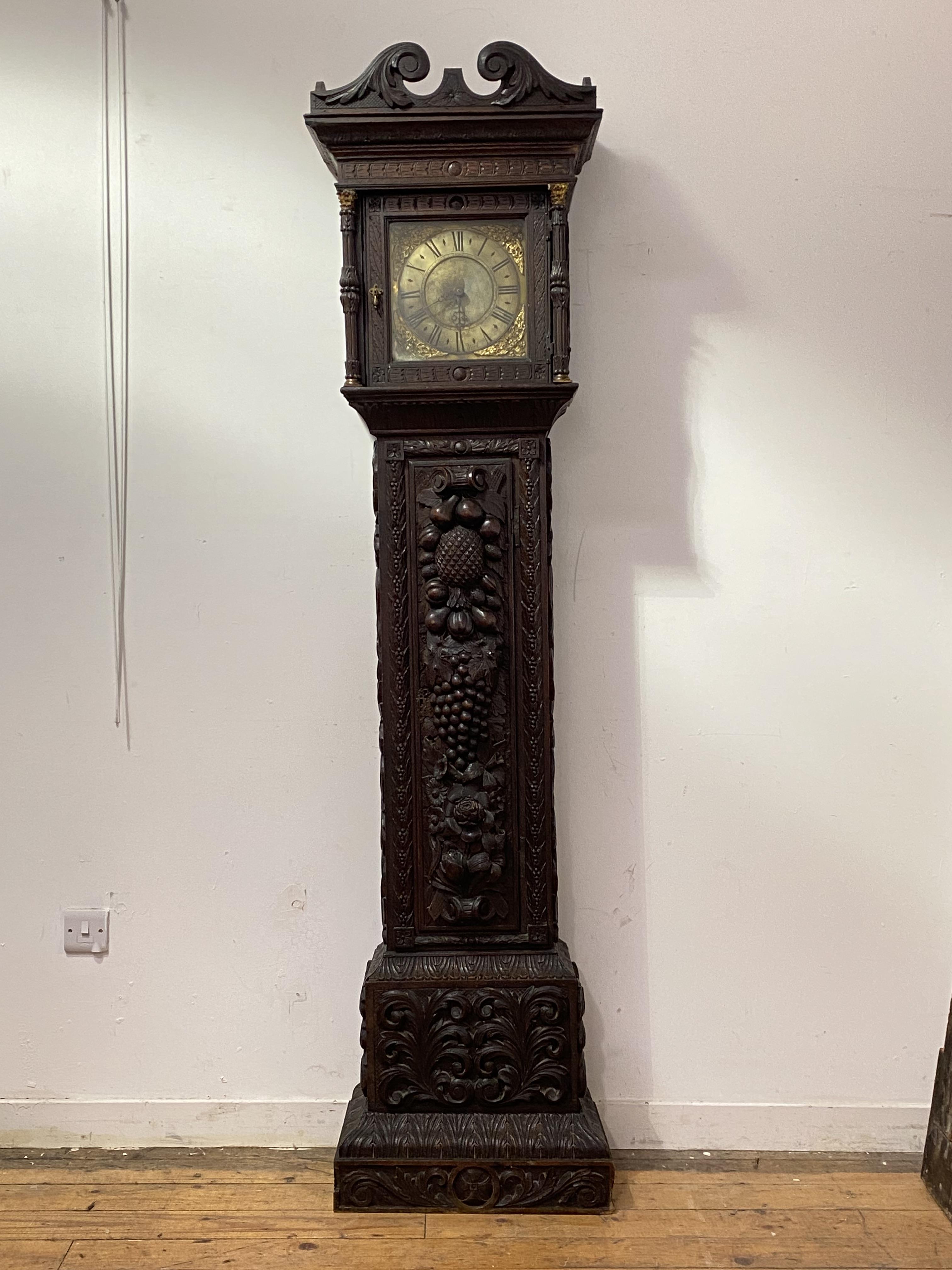 An English stained oak longcase clock, 18th century and later, the case profusely carved with - Image 3 of 3