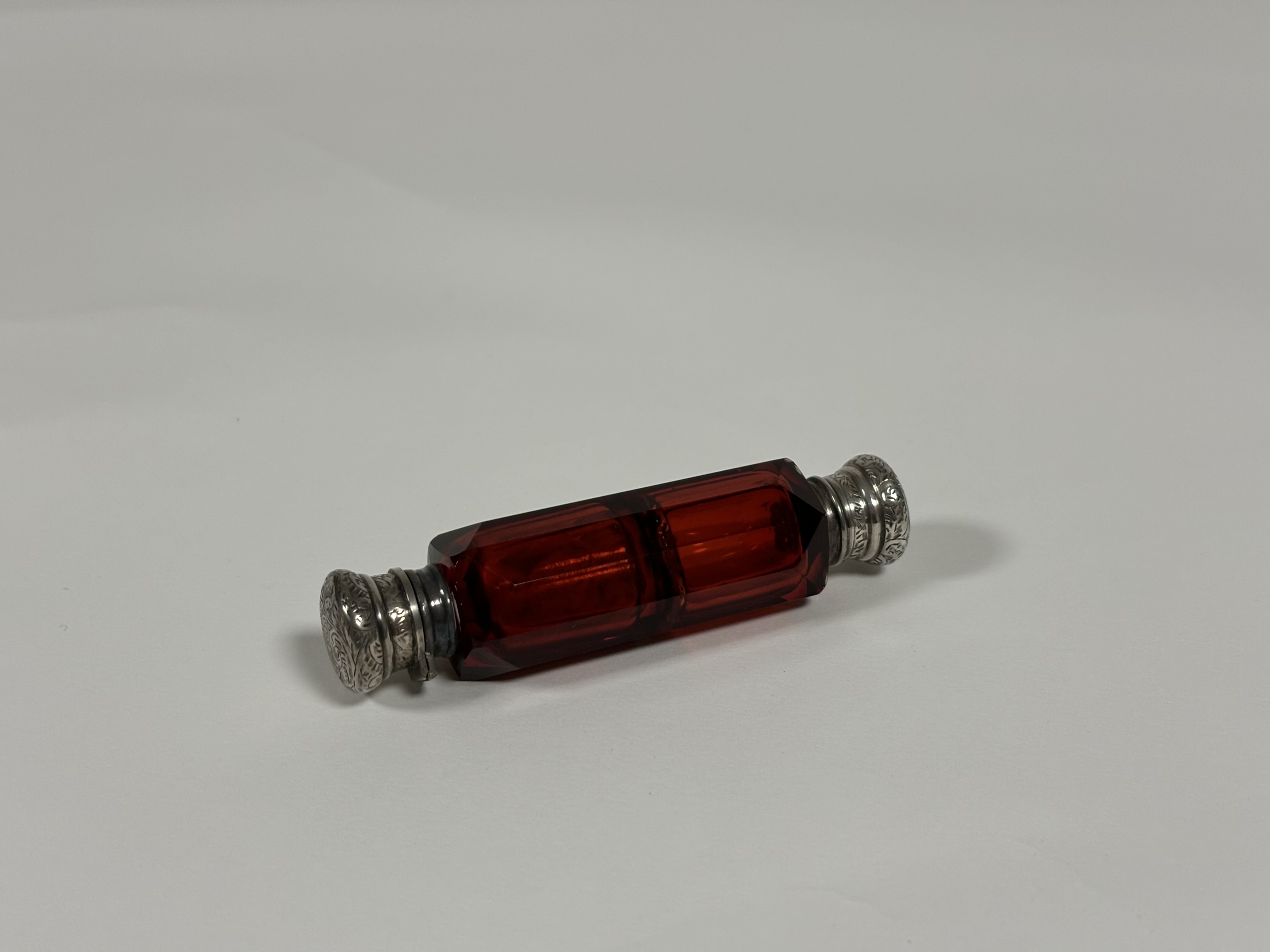 Two late 19th century ruby glass scent bottles: the first double-ended in faceted glass with - Image 6 of 10