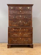 A George II walnut chest on chest or tallboy, mid 18th century, the projecting cornice over a