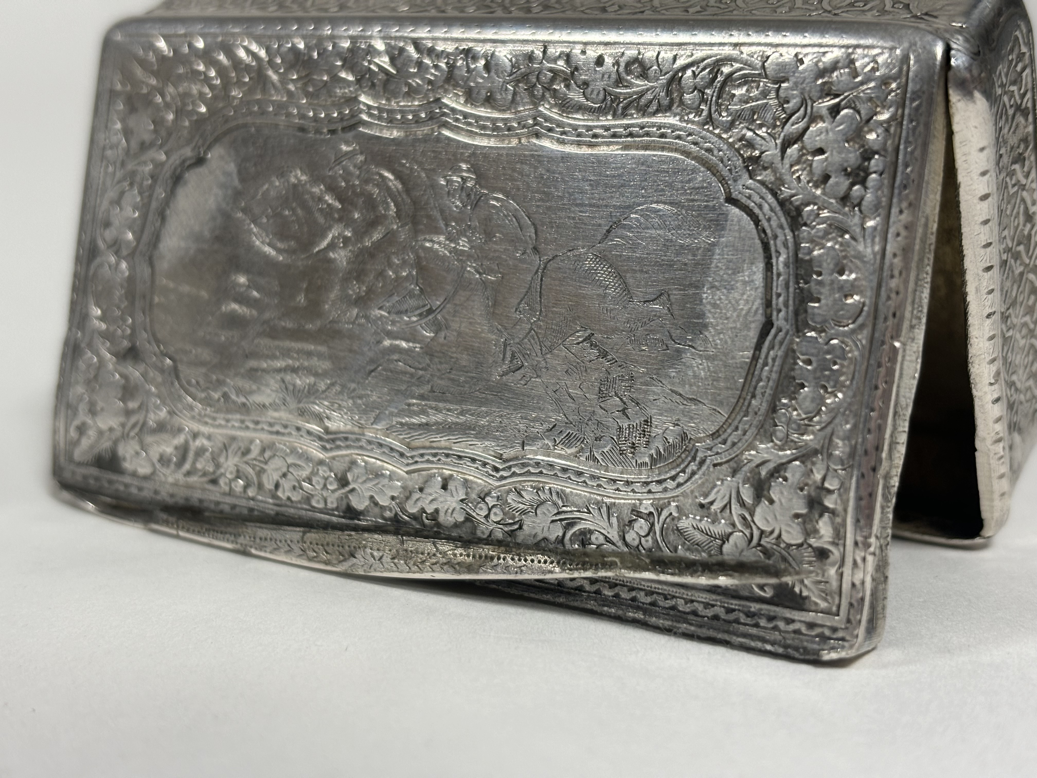 A French 19th century silver snuff box, of rectangular form, the cover engraved with a horse- - Image 2 of 4
