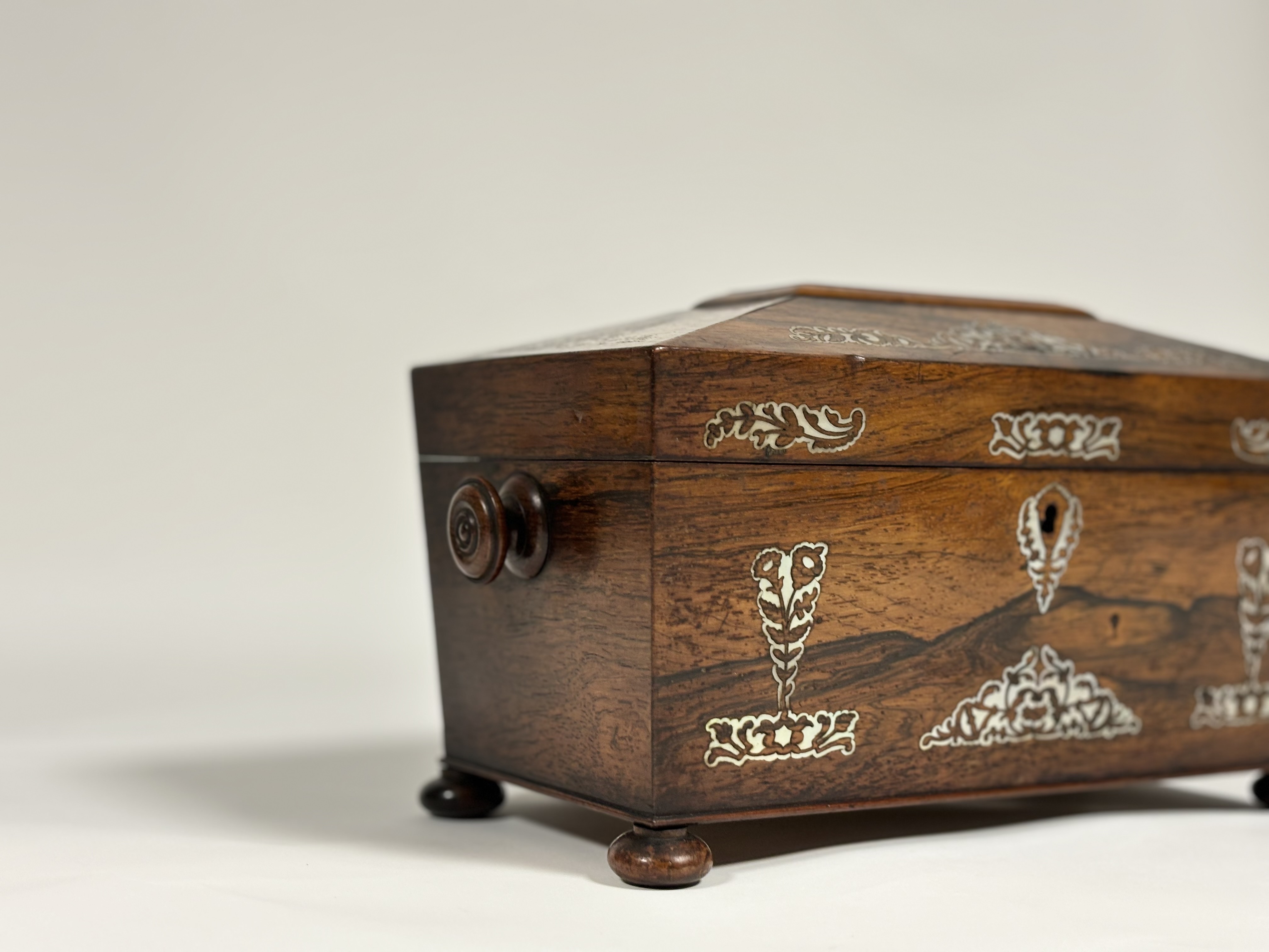 A William IV mother-of-pearl inlaid rosewood tea caddy, of sarcophagus shape, with turned handles - Image 2 of 8