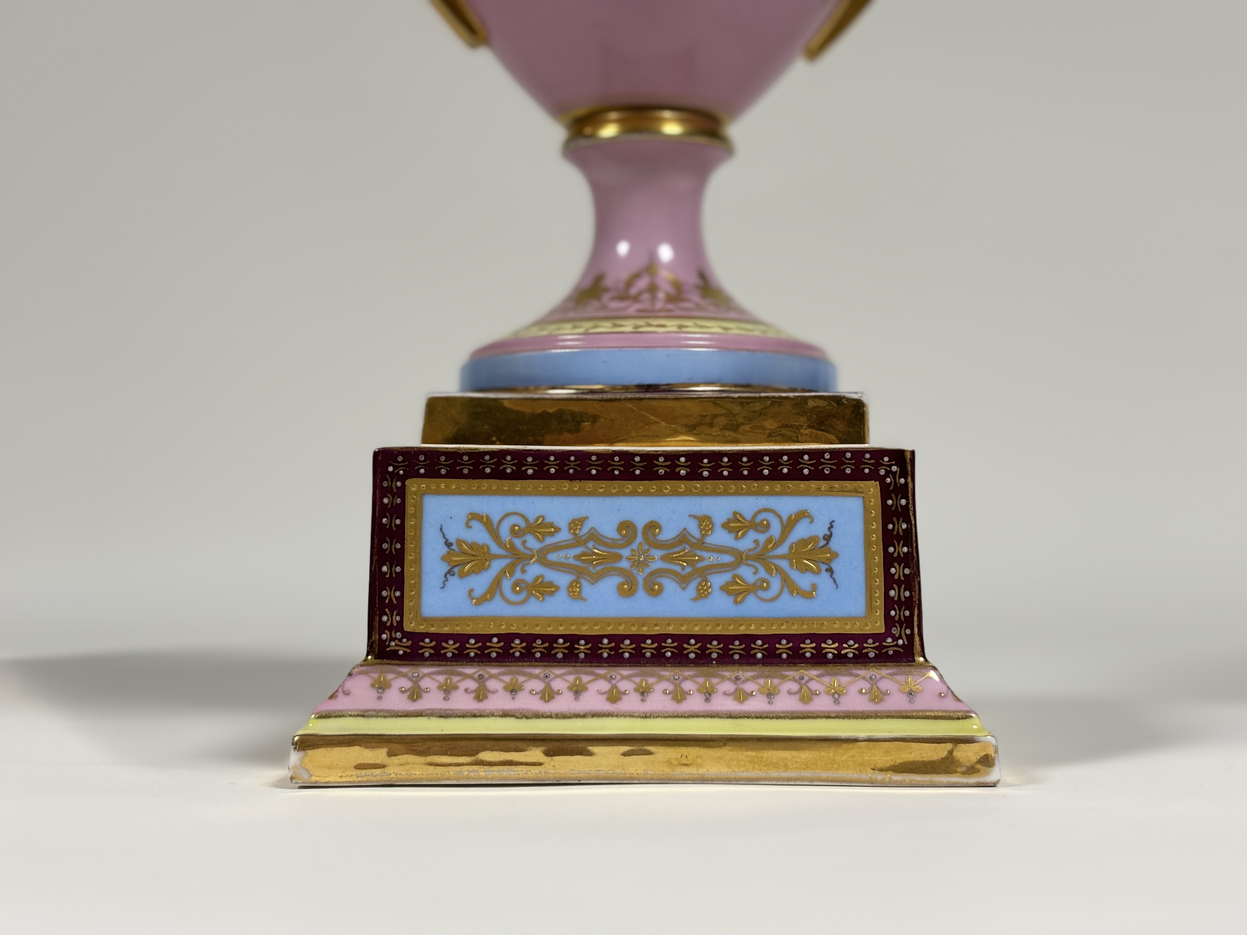 A late 19th century Vienna porcelain covered urn on stand, of hipped baluster form, painted with a - Image 7 of 8