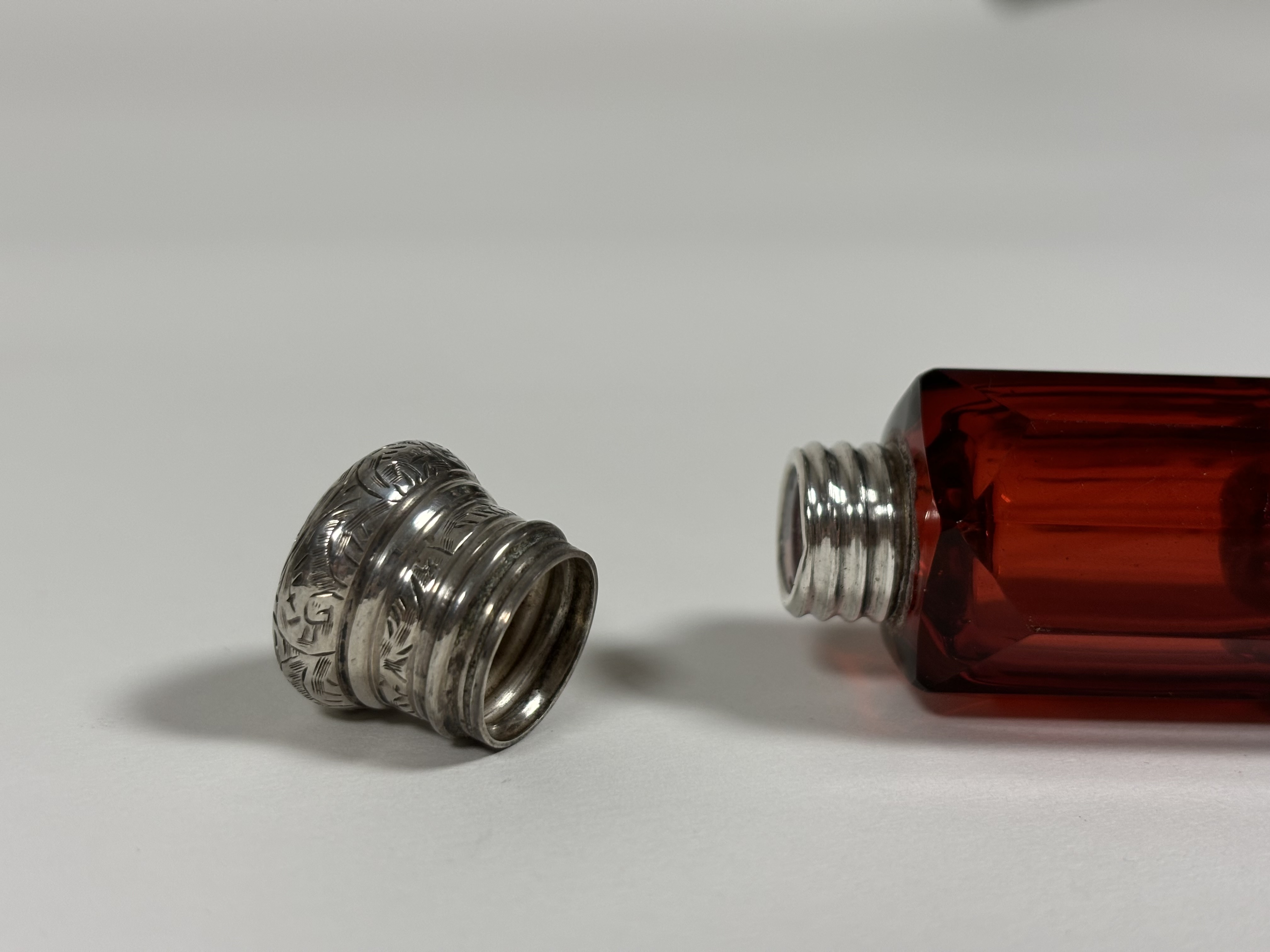 Two late 19th century ruby glass scent bottles: the first double-ended in faceted glass with - Image 10 of 10