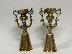 A striking pair of Continental silver-gilt wager or marriage cups, 19th century, of characteristic