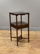 A Georgian mahogany bedside table, the square top raised on square section supports united by an