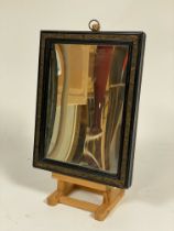 A concave wall-hanging shaving mirror, second quarter of the 19th century, the rectangular plate