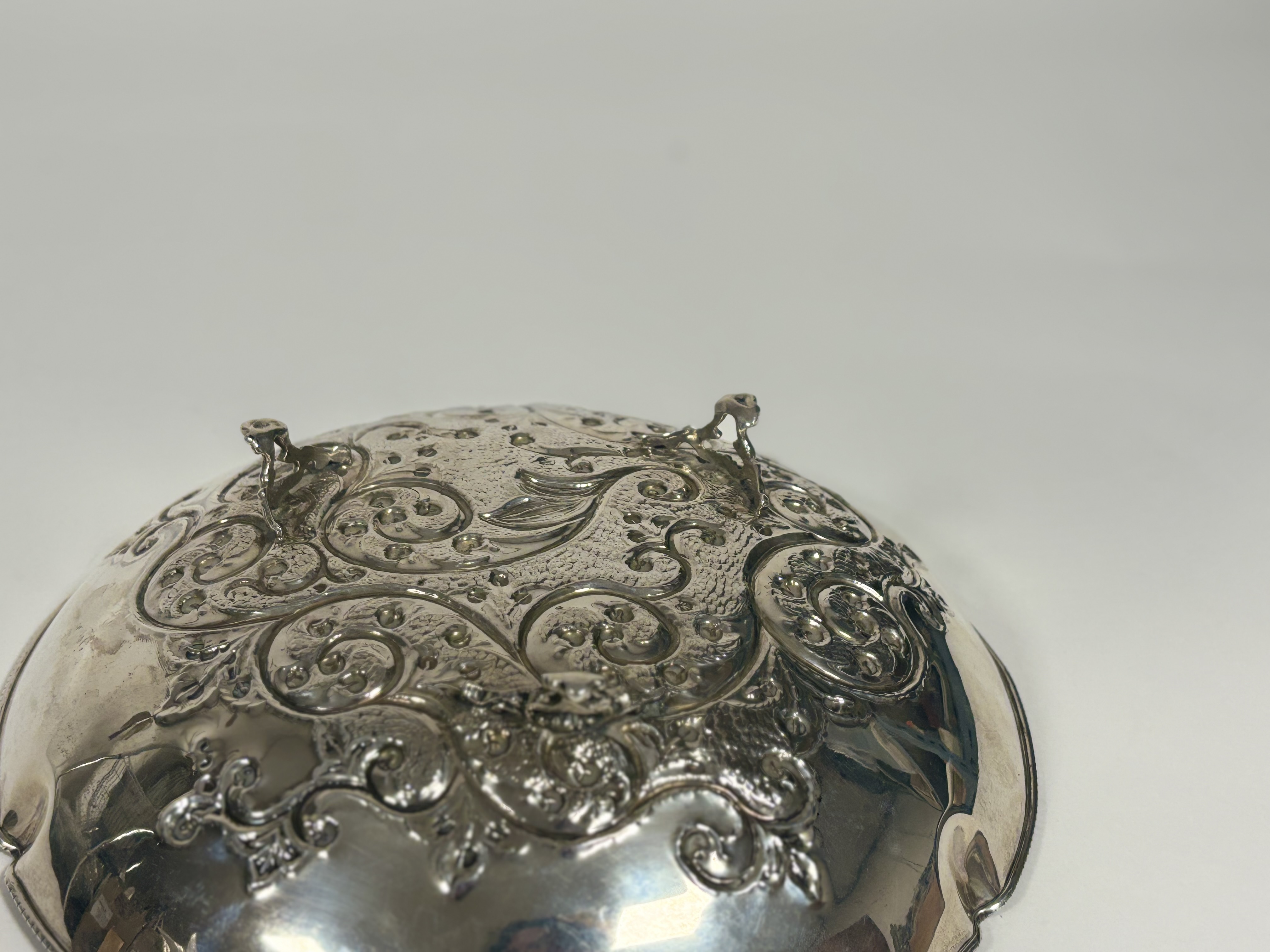 A Continental silver centre bowl, circular, the well repousse with scrolling foliage, raised on - Image 4 of 4