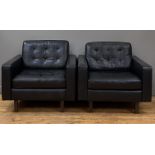 Heals, a pair of lounge chairs, upholstered in buttoned semi-aniline black leather and standing on