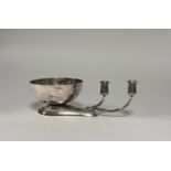 A modernist silver table centrepiece, maker's mark PDB, London 1978, formed of a planished bowl on a