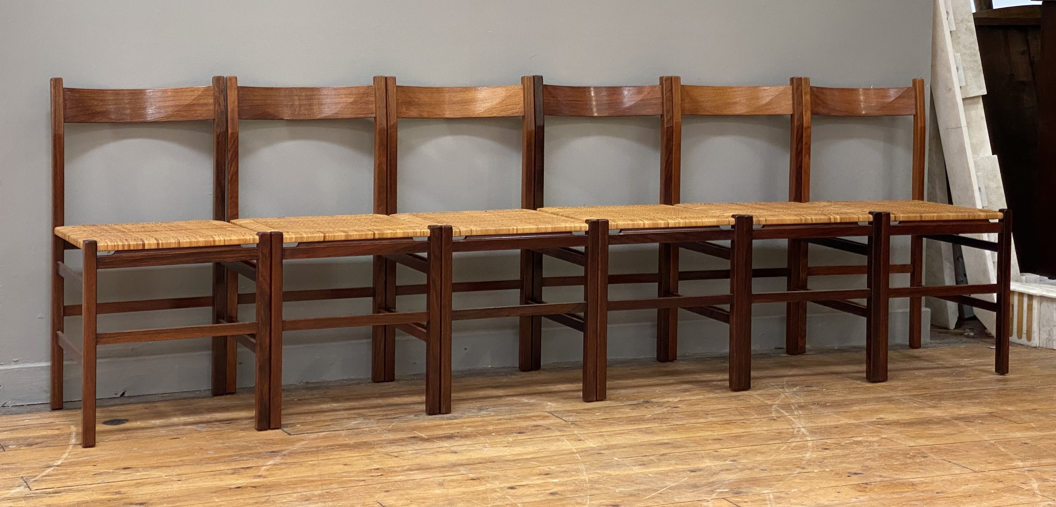 A set of six Danish rosewood dining chairs, circa 1960's, the curved and shaped crest rail above a - Image 2 of 4