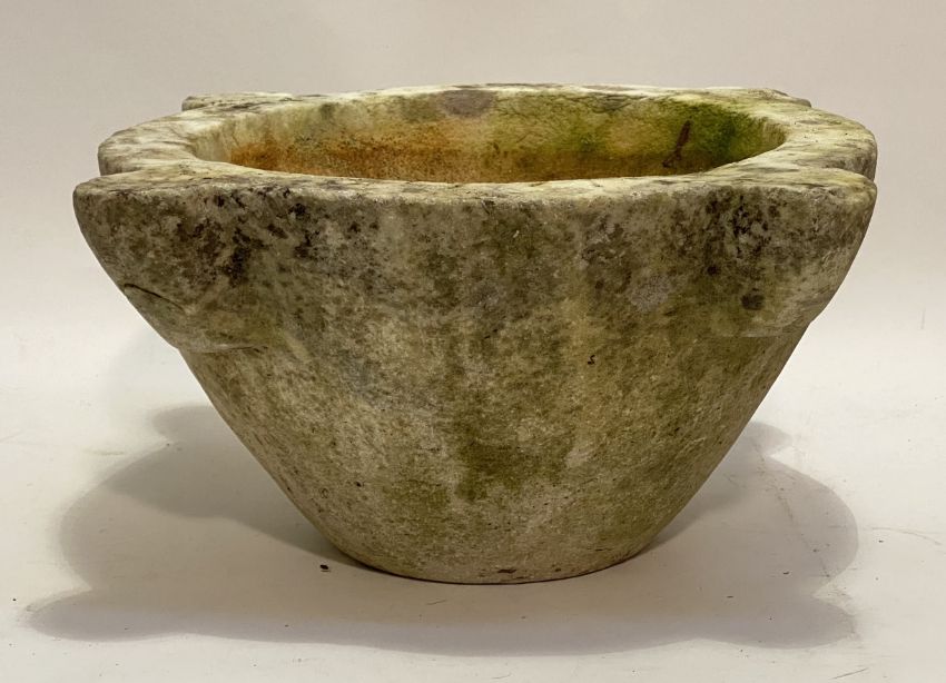 A large 19th century marble mortar, of characteristic form (weathered). 19cm by 42cm (across lugs)