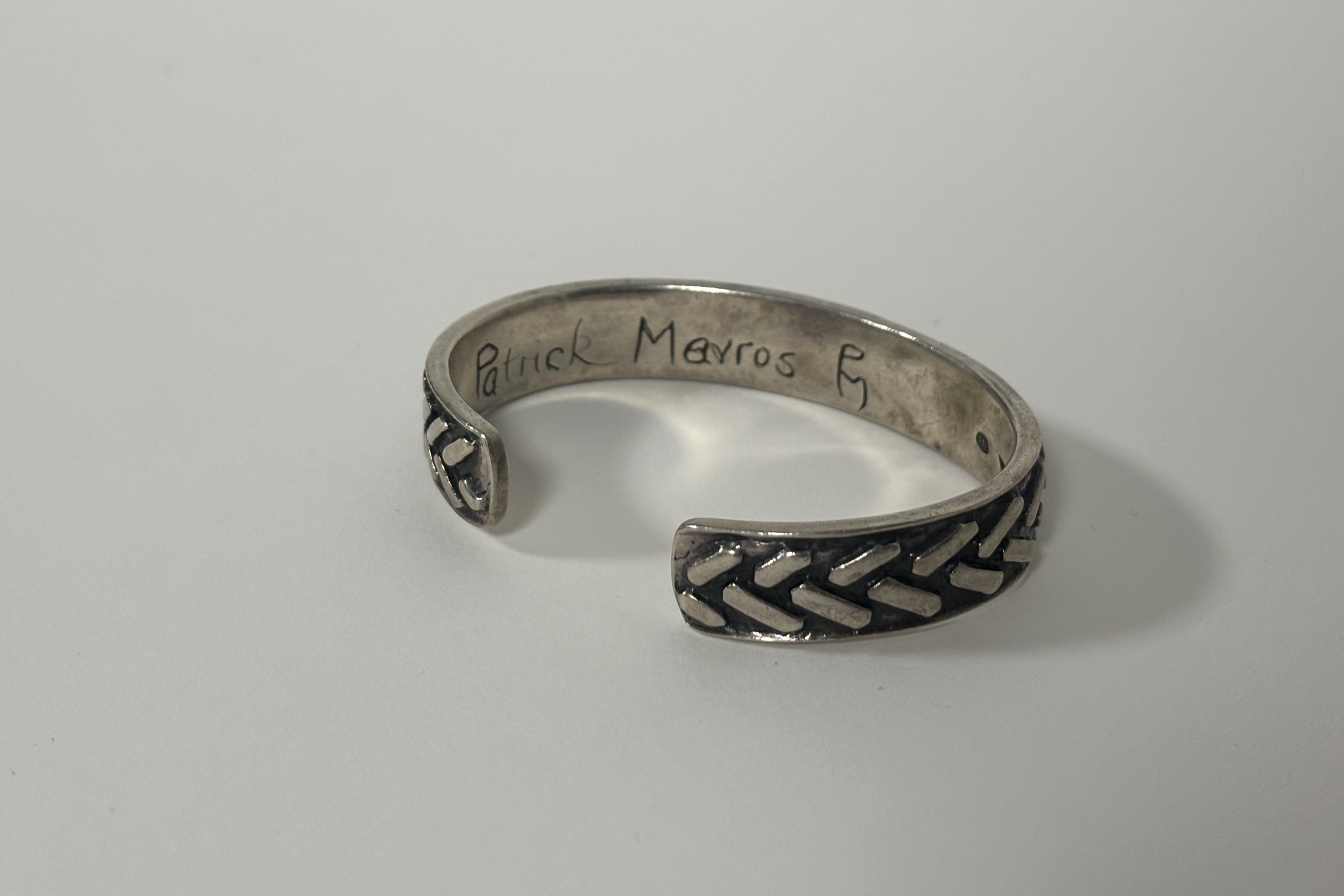 Patrick Mavros, a sterling silver bangle, repousse with a chevron pattern against a blackened - Image 2 of 2