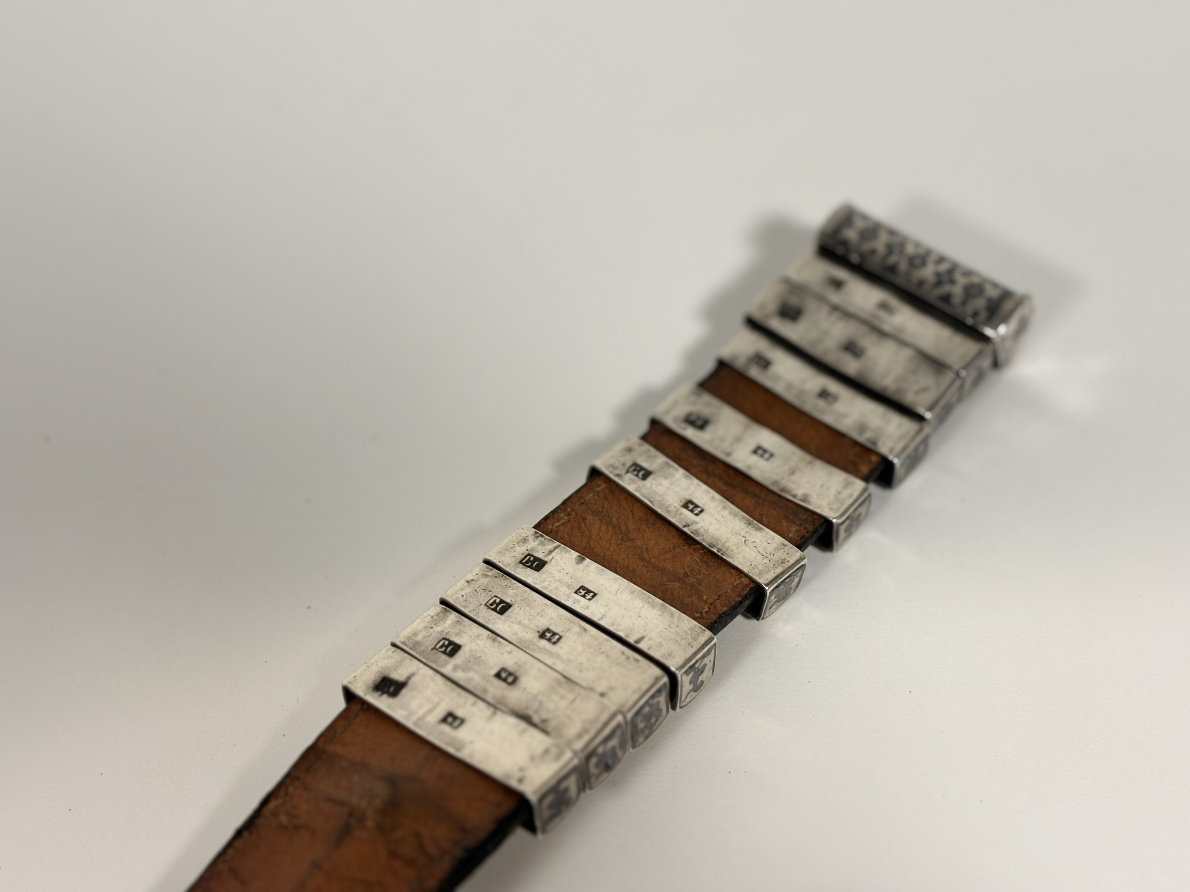 A Russian Imperial period niello silver-mounted leather belt, stamped marks including Assay Master - Image 7 of 8