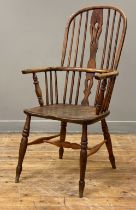 An elm and ash Windsor elbow chair, 19th century and later, the double hoop and spindle back above a