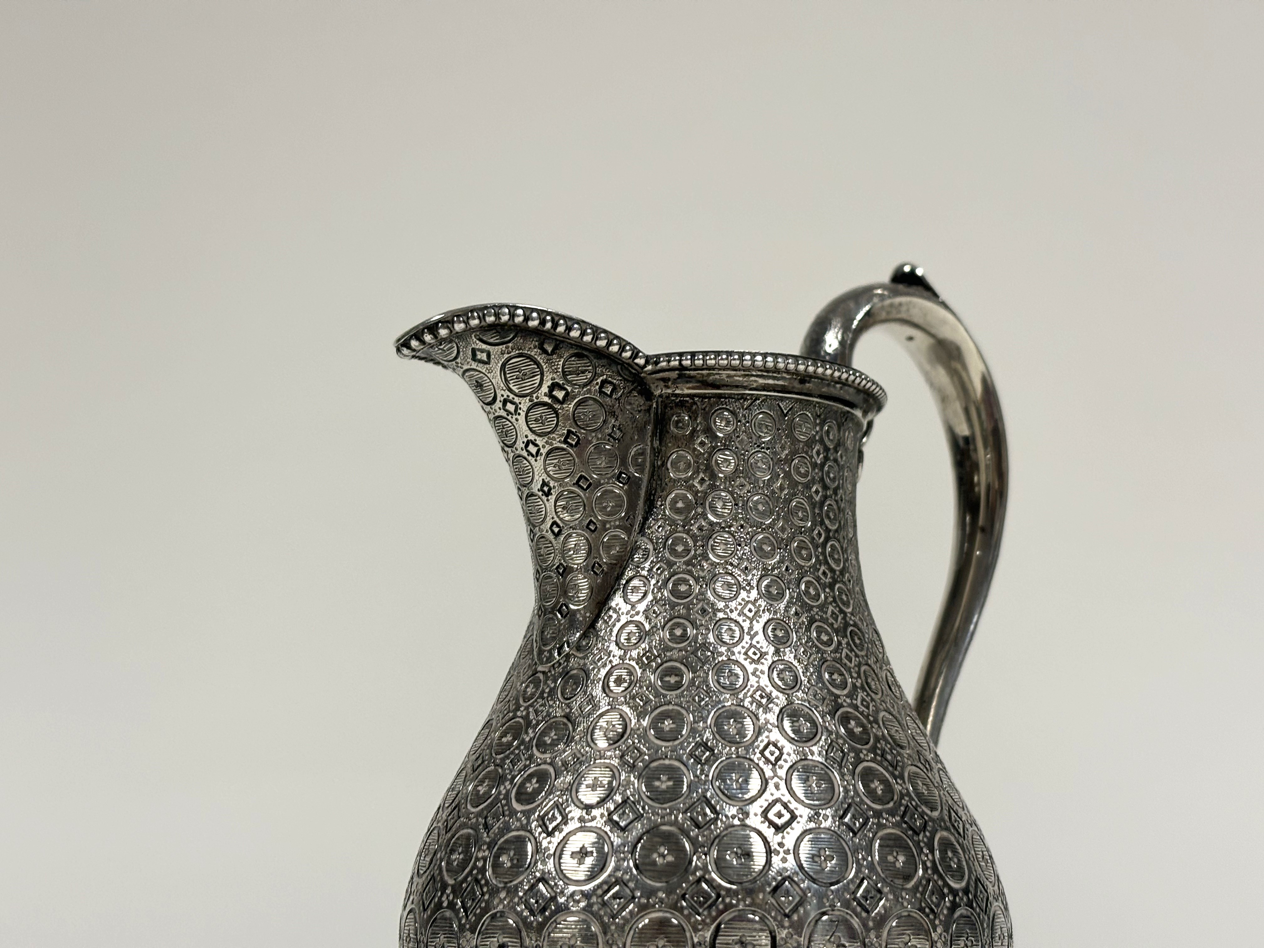 A mid-Victorian silver baluster cream jug, Edward & John Barnard, London 1863, densely engraved with - Image 2 of 5