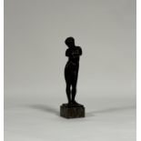 After the Antique, a bronze figure of a standing female bather, unsigned, mounted on a marble