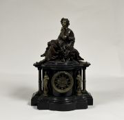 A French patinated and gilt bronze mounted slate mantel clock, late 19th century, the well-cast