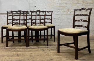 A set of six George III mahogany ribbon back dining chairs, of characteristic form, with drop in