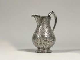 A mid-Victorian silver baluster cream jug, Edward & John Barnard, London 1863, densely engraved with