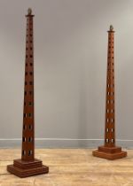 A pair of modern  floor lamps, stained ash square tapered and pierced columns on stepped square