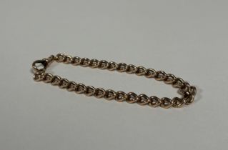 A yellow metal curblink bracelet, with lobster clasp, stamped "9k". Length 20cm, 16 grams