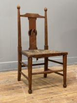 Liberty & Co, an Arts and Crafts period oak 'Nursery-Rhyme' chair, the back splat with pictorial