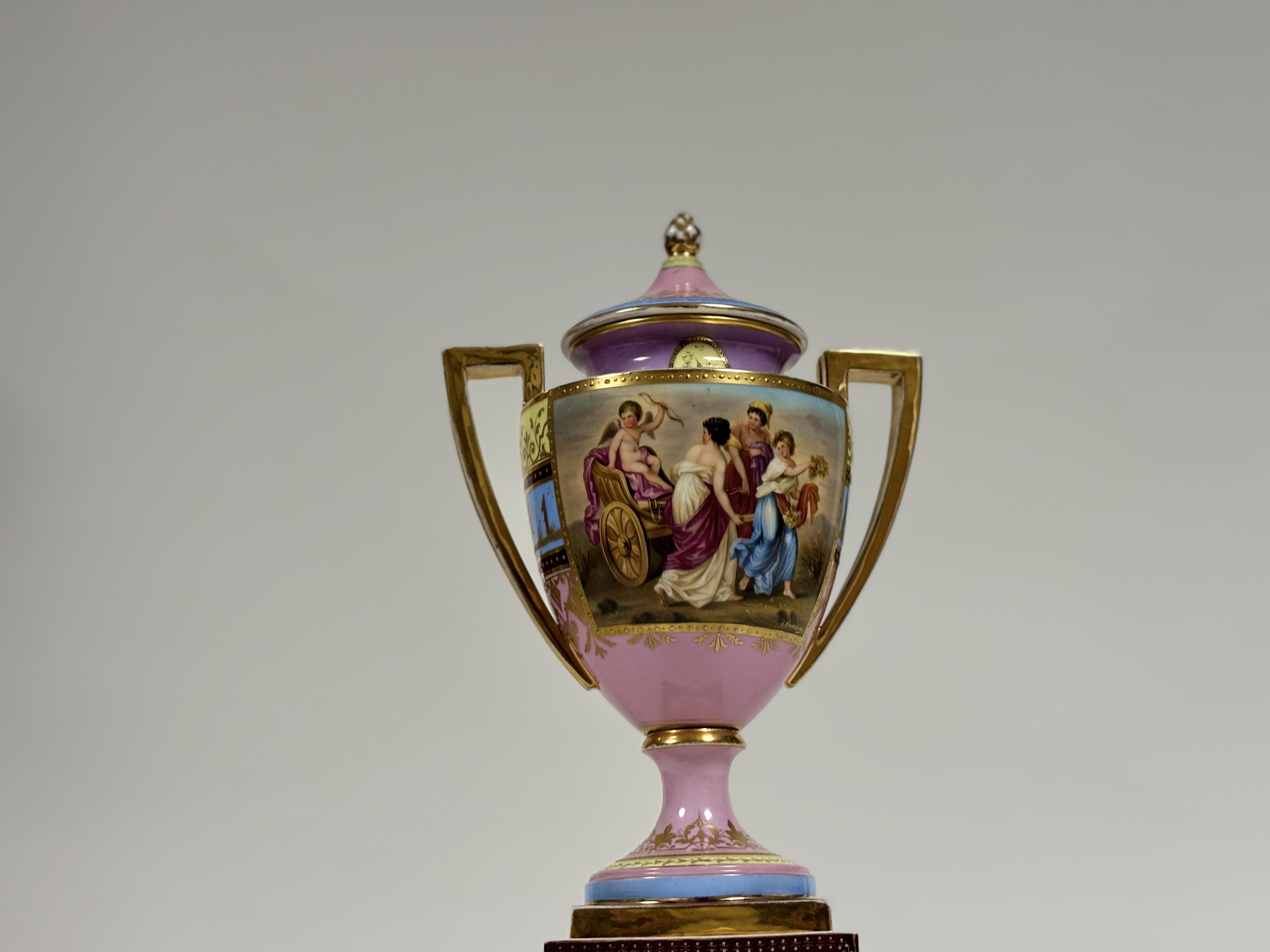 A late 19th century Vienna porcelain covered urn on stand, of hipped baluster form, painted with a - Image 8 of 8