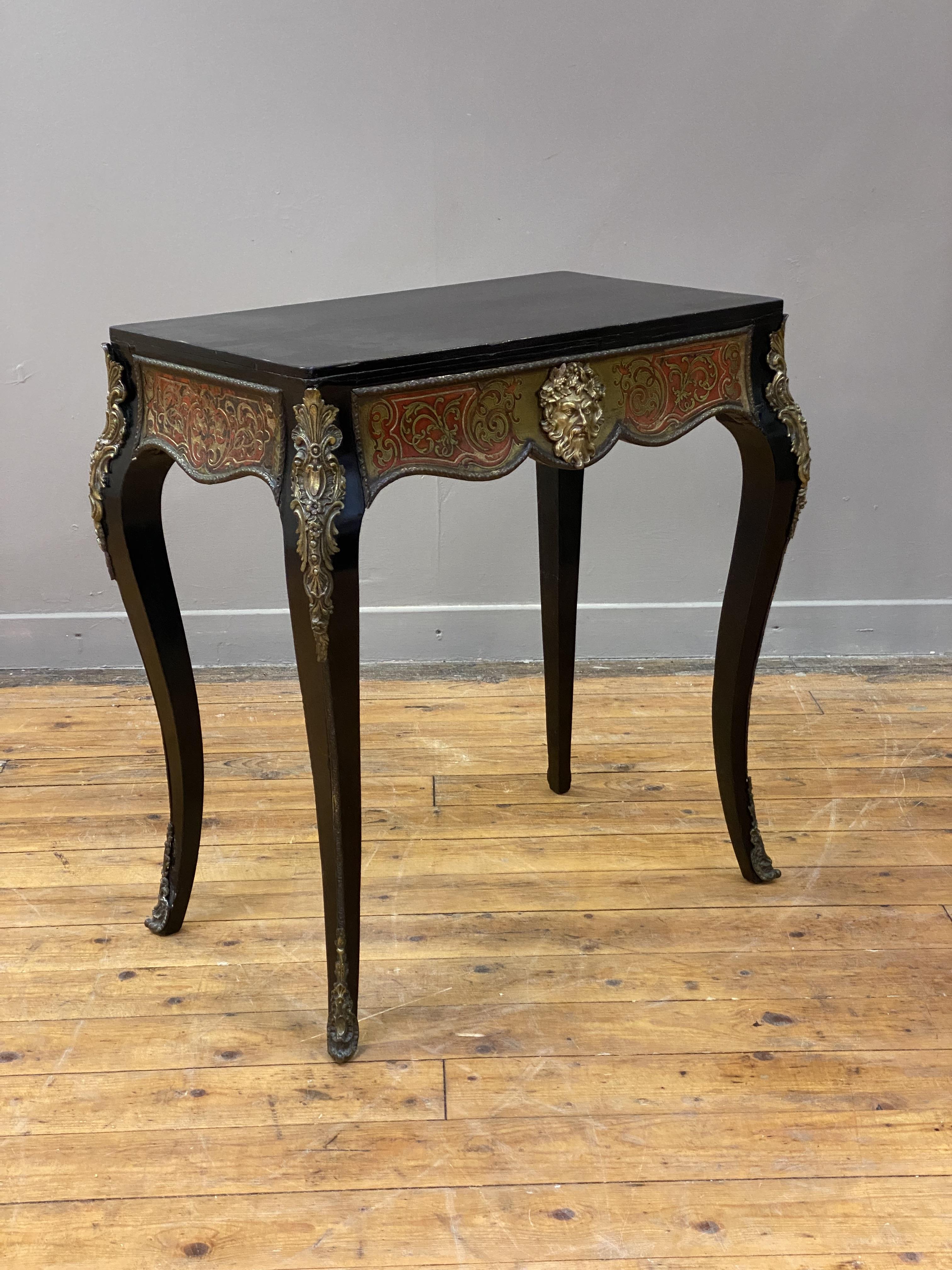 An ebonized and boulle-work side table of rectangular outline, late 19th century, the frieze with