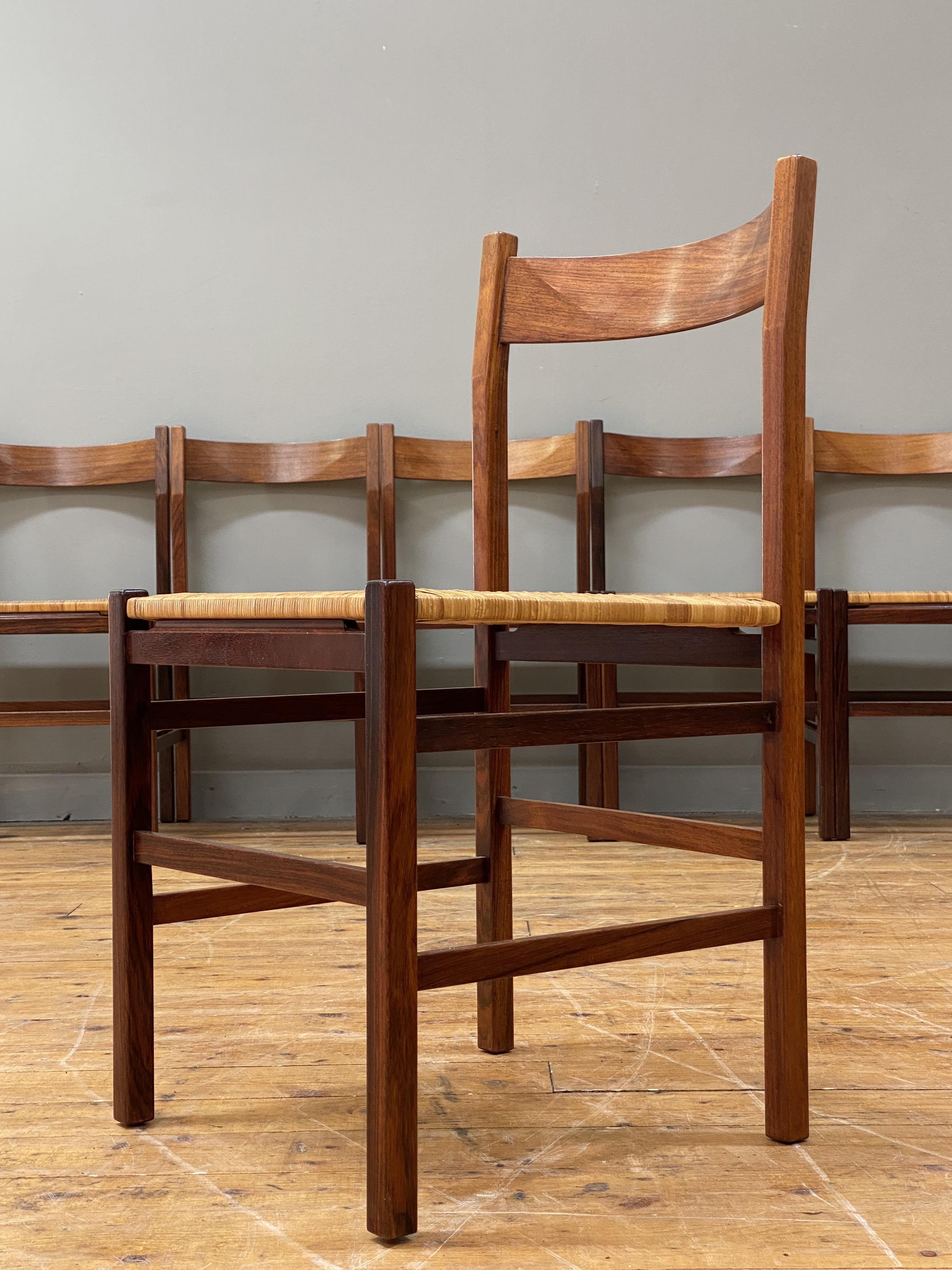 A set of six Danish rosewood dining chairs, circa 1960's, the curved and shaped crest rail above a - Image 3 of 4