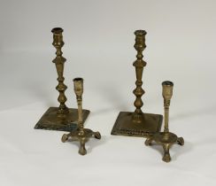 Two pairs of brass candlesticks, late 18th century: the smaller pair with faceted cups over square
