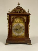 A large late 19th / early 20th century bracket clock, the domed mahogany case with four acorn finals